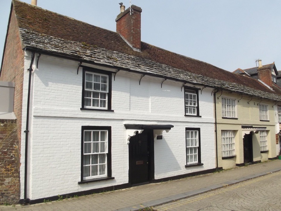 Painted brick cottages on Church Street in Christchurch, Dorset
