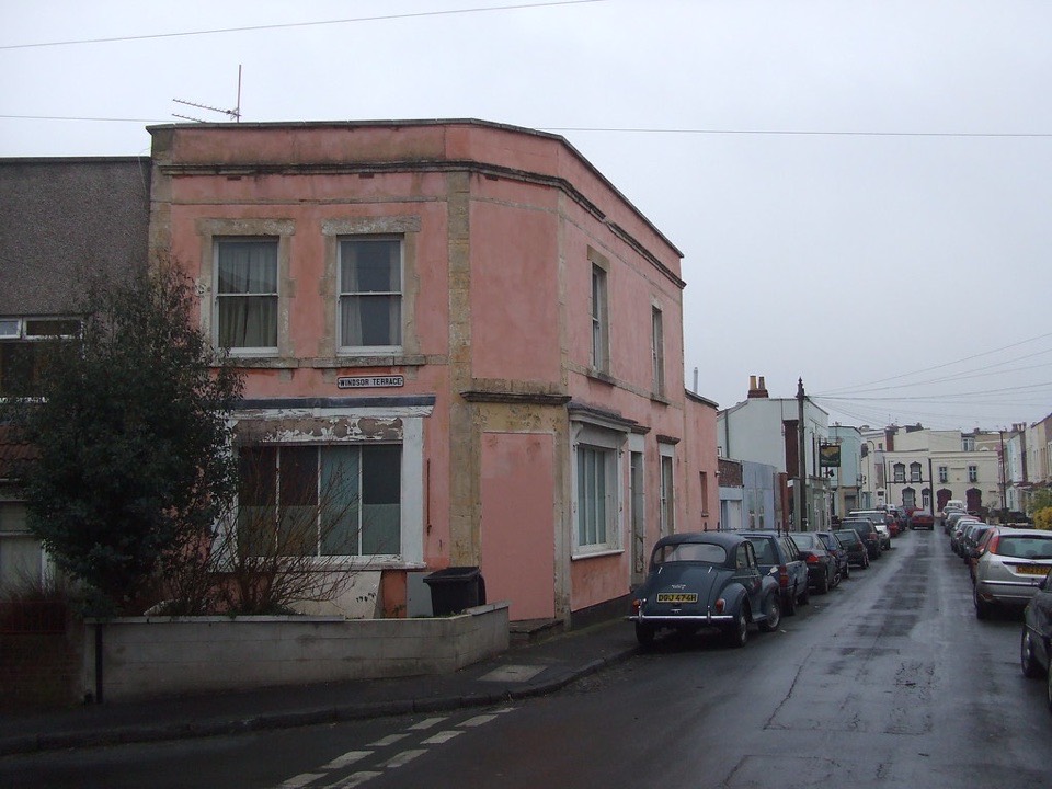 A painted render terrace on a steep street at Totterdown in Bristol